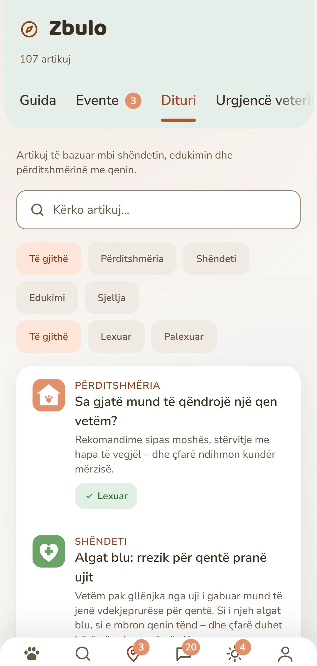 Pamje nga aplikacioni DOGSY te skeda «Zbulo»: krejt lart numri i artikujve, poshtë tij katër skedat Guide, Events, Njohuri dhe Urgjencë për kafshët. Vijojnë një fushë kërkimi dhe filtra të rrumbullakët për rubrikat – Të gjitha, Përditshmëria, Shëndeti, Sjellja, Edukimi. Poshtë tyre artikujt si karta: majtas një simbol me ngjyrë i rubrikës, pranë tij rubrika me shkronja të mëdha, titulli dhe një hyrje e shkurtër. Krejt në fund shiriti i navigimit të aplikacionit. Pamja shfaqet në gjuhën e kësaj faqeje.